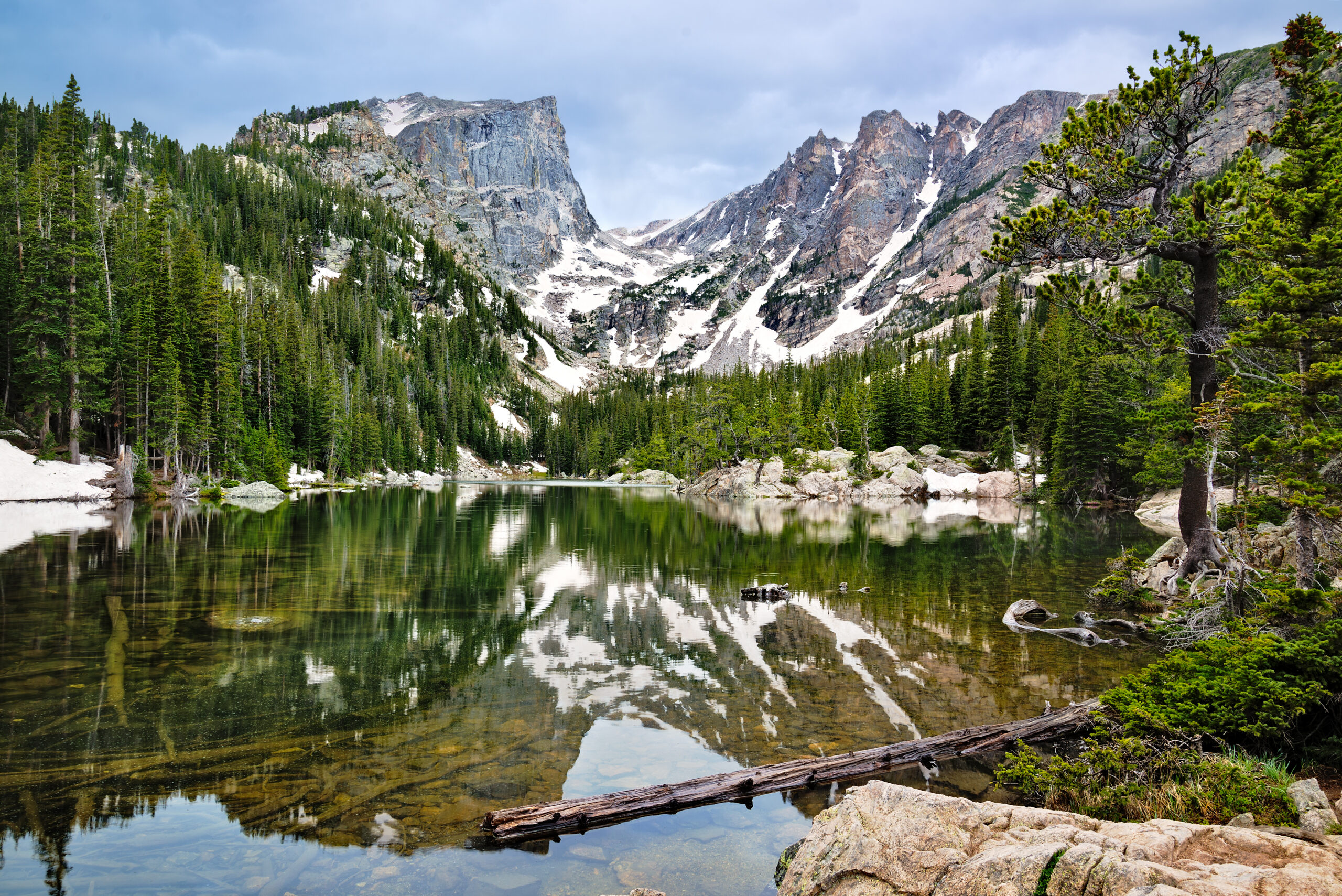 Rocky Mountain National Park guide featuring Bear Lake, Trail Ridge Road, alpine lakes, wildlife, hikes, timed entry, and family travel tips